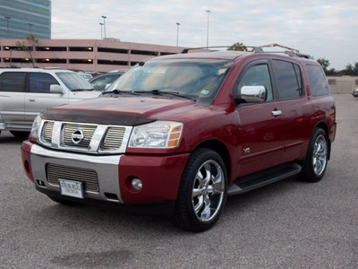 nissan armada 2005 dk  red suv le 8 cylinders automatic with overdrive 77074
