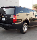 chevrolet suburban 2011 black suv lt 1500 8 cylinders automatic with overdrive 77074