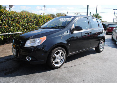 chevrolet aveo5 2009 black hatchback lt gasoline 4 cylinders front wheel drive automatic with overdrive 77581