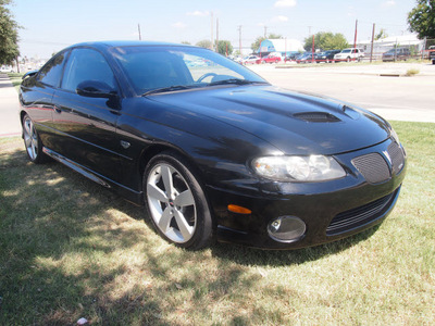 pontiac gto 2005 black coupe gasoline 8 cylinders rear wheel drive automatic 75067