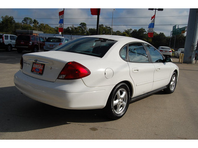 ford taurus 2003 white sedan ses 6 cylinders automatic with overdrive 77706