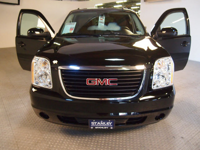 gmc yukon 2009 black suv sle 8 cylinders automatic 75219