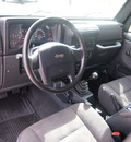jeep wrangler 2004 black suv rubicon gasoline 6 cylinders 4 wheel drive 5 speed manual 76049