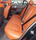 jaguar xf 2010 black sedan premium 8 cylinders automatic with overdrive 77074