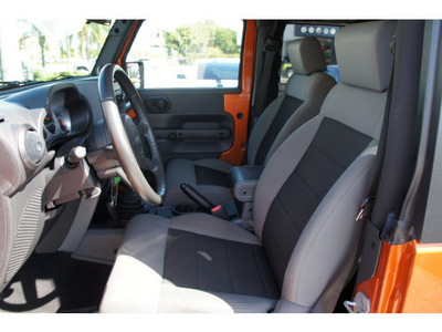 jeep wrangler 2010 orange suv sport gasoline 6 cylinders 4 wheel drive 6 speed manual 33157