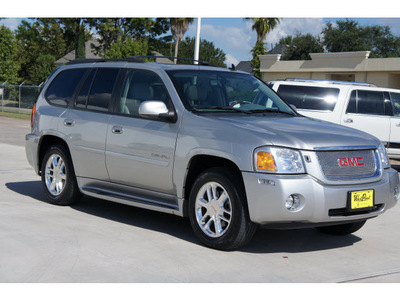 gmc envoy 2006 silver suv denali gasoline 8 cylinders rear wheel drive automatic 77043