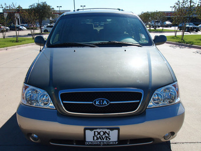 kia sedona 2005 dk  green van ex gasoline 6 cylinders front wheel drive automatic with overdrive 76018