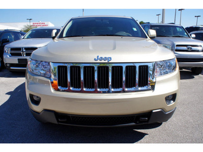jeep grand cherokee 2011 gold suv laredo gasoline 6 cylinders 4 wheel drive automatic 33157