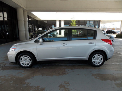 nissan versa 2011 silver hatchback 1 8 s gasoline 4 cylinders front wheel drive automatic with overdrive 77477