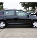 nissan versa 2012 black hatchback 1 8 s gasoline 4 cylinders front wheel drive not specified 77477