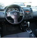 nissan versa 2012 silver hatchback 1 8 sl gasoline 4 cylinders front wheel drive automatic 76502