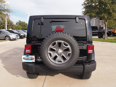 jeep wrangler unlimited 2013 black suv rubicon gasoline 6 cylinders 4 wheel drive automatic 75093