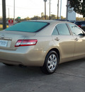 toyota camry 2010 tan sedan le 4 cylinders automatic with overdrive 77074