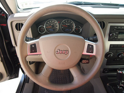 jeep commander 2010 black suv sport gasoline 6 cylinders 2 wheel drive automatic 76011
