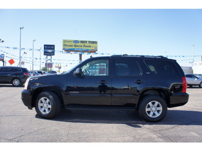 gmc yukon 2012 black suv slt flex fuel 8 cylinders 2 wheel drive 6 speed automatic 76710