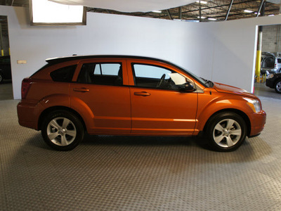 dodge caliber 2011 orange hatchback mainstreet gasoline 4 cylinders front wheel drive automatic 75219