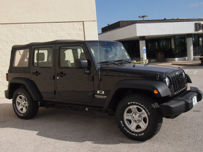 jeep wrangler unlimited 2009 black suv x gasoline 6 cylinders 2 wheel drive automatic with overdrive 76011