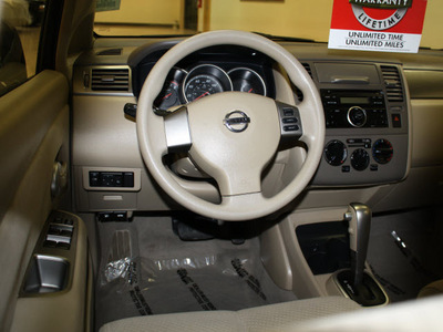 nissan versa 2011 dk  brown hatchback 1 8 s gasoline 4 cylinders front wheel drive automatic 27707