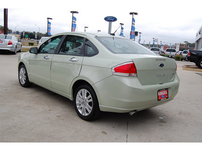 ford focus 2010 kiwi green metallic sedan sel gasoline 4 cylinders front wheel drive automatic with overdrive 77706