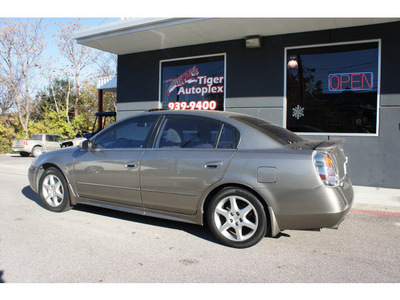 nissan altima 2003 tan sedan 3 5 se gasoline 6 cylinders dohc front wheel drive 6 speed manual 76513