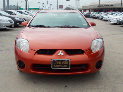 mitsubishi eclipse 2007 orange hatchback gs gasoline 4 cylinders front wheel drive shiftable automatic 77074