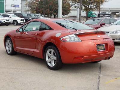 mitsubishi eclipse 2007 orange hatchback gs gasoline 4 cylinders front wheel drive shiftable automatic 77074