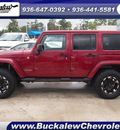 jeep wrangler unlimited 2012 red suv sahara gasoline 6 cylinders 4 wheel drive automatic 77304