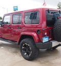 jeep wrangler unlimited 2012 red suv sahara gasoline 6 cylinders 4 wheel drive automatic 77304