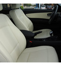 bmw 1 series 2009 white coupe 128i gasoline 6 cylinders rear wheel drive 6 speed manual 77002