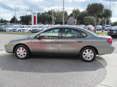 ford taurus 2003 tan sedan sel gasoline 6 cylinders front wheel drive automatic 33884