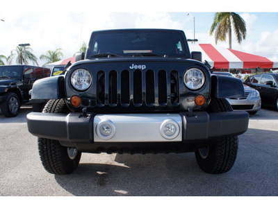 jeep wrangler 2012 black suv sahara gasoline 6 cylinders 4 wheel drive 6 speed manual 33157