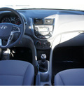 hyundai accent 2013 black hatchback se m t gasoline 4 cylinders front wheel drive standard 77094