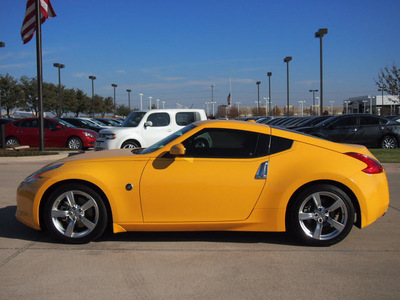 nissan 370z 2009 yellow coupe touring gasoline 6 cylinders rear wheel drive automatic 76018