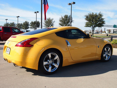 nissan 370z 2009 yellow coupe touring gasoline 6 cylinders rear wheel drive automatic 76018