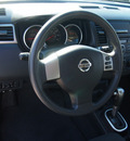 nissan versa 2009 black hatchback 1 8 s gasoline 4 cylinders front wheel drive automatic 77539
