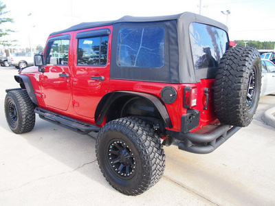 jeep wrangler unlimited 2011 red suv sport gasoline 6 cylinders 4 wheel drive automatic 77539