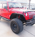 jeep wrangler unlimited 2011 red suv sport gasoline 6 cylinders 4 wheel drive automatic 77539