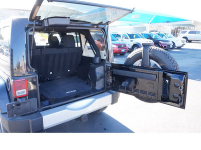 jeep wrangler unlimited 2011 black suv sahara gasoline 6 cylinders 4 wheel drive automatic 78028