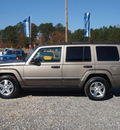 jeep commander 2006 tan suv gasoline 6 cylinders 4 wheel drive not specified 27569