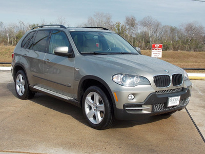 bmw x5 2010 lt  brown suv xdrive30i gasoline 6 cylinders all whee drive shiftable automatic 77074