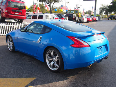 nissan 370z 2009 blue coupe gasoline 6 cylinders rear wheel drive manual 33021