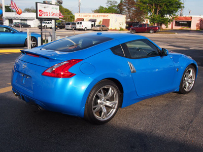 nissan 370z 2009 blue coupe gasoline 6 cylinders rear wheel drive manual 33021