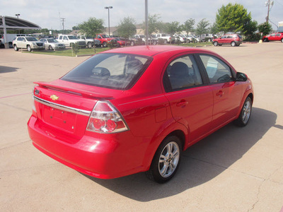 chevrolet aveo 2011 red sedan lt gasoline 4 cylinders front wheel drive automatic 76049