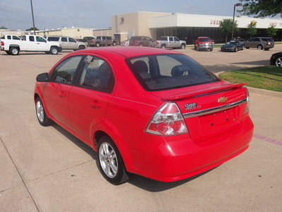 chevrolet aveo 2011 red sedan lt gasoline 4 cylinders front wheel drive automatic 76049