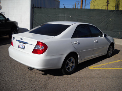 toyota camry 2003 white sedan gasoline 4 cylinders front wheel drive automatic 79925