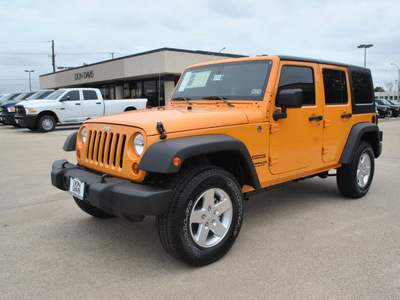 jeep wrangler unlimited 2012 orange suv sport gasoline 6 cylinders 4 wheel drive automatic 76011