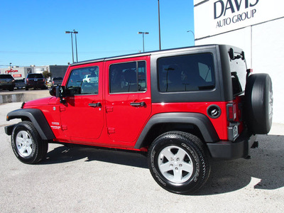 jeep wrangler unlimited 2011 red suv sport gasoline 6 cylinders 4 wheel drive automatic 76011