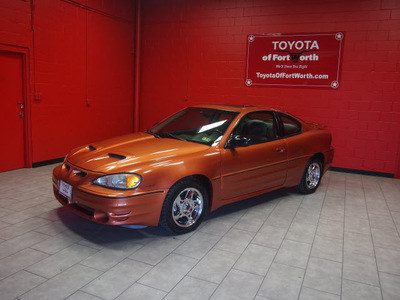 pontiac grand am 2004 orange coupe gt gasoline 6 cylinders front wheel drive automatic 76116