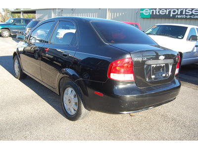 chevrolet aveo 2005 black sedan ls gasoline 4 cylinders front wheel drive automatic with overdrive 77627