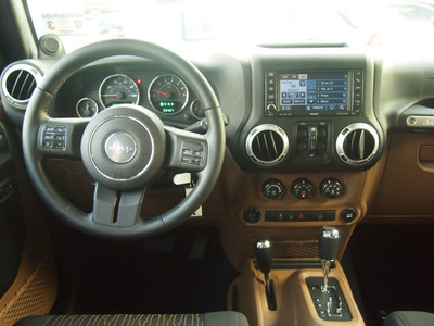 jeep wrangler unlimited 2012 black suv sahara gasoline 6 cylinders 4 wheel drive automatic 77074
